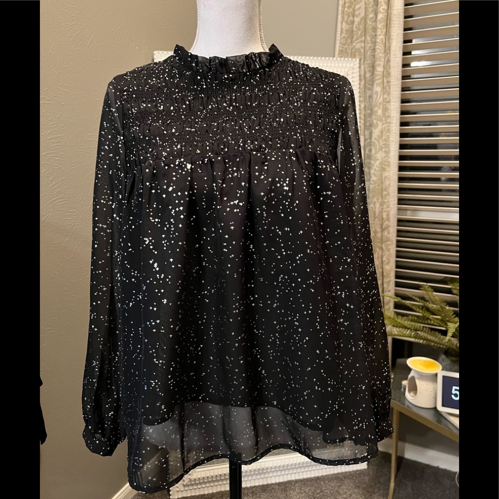 Great holiday top, black cami underneath.